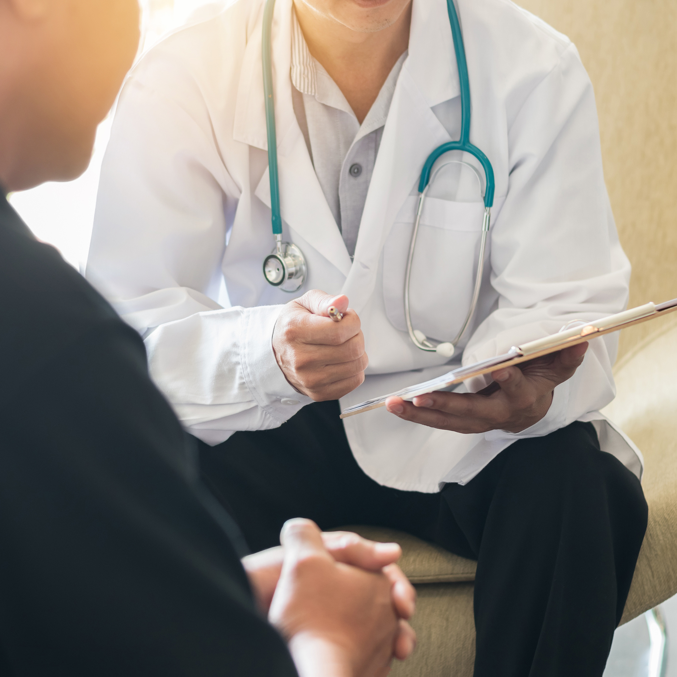 A primary care doctor seeing a patient for a walk-in appointment